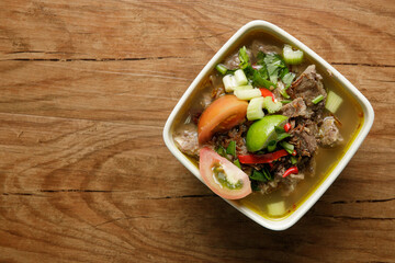 Delicious Beef soup shoot on wooden table