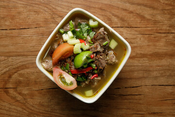 Delicious Beef soup shoot on wooden table