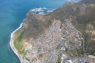 Cape Town, Western Cape / South Africa - 11/26/2020: Aerial photo of Hangberg with The Sentinel in the background