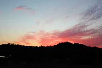 cloud and vanilla sky background with dark mountain silhouette