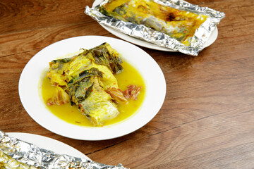 Signature dish of Pahang, Malaysia known as Gulai Patin Masak Tempoyak and Pais Patin.