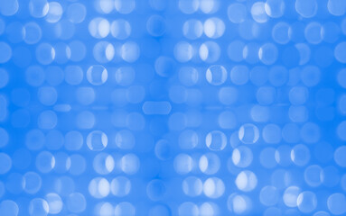 New Year and Christmas holiday concept. Shimmer glitter bokeh wallpaper. Sparkle dark blue rounds. 