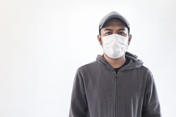 asian man in hoodie wearing protection mask prevention for coronavirus (covid-19) , copy space.