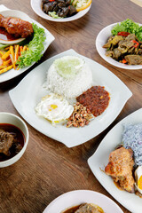Delicious Malay cuisine Nasi Lemak with fried egg and cucumber slice