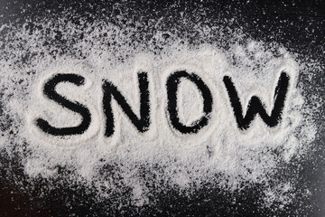 Word snow on a black background