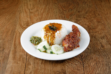 Nasi kukus ayam merah, popular traditional Malay local food.