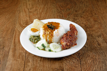 Nasi kukus ayam merah, popular traditional Malay local food.