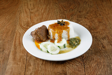 Nasi kukus daging kari, popular traditional Malay local food.