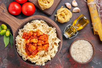 top view chicken with dough pasta dish with tomatoes on dark floor pasta dough meal