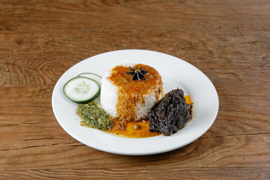 Nasi kukus daging kicap, popular traditional Malay local food.00