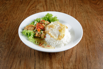 a plate of chicken butter milk with rice