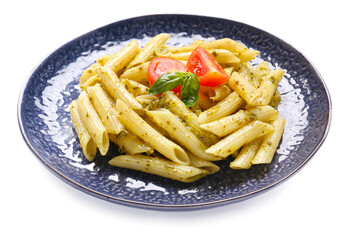 Plate with tasty pasta and pesto sauce on white background