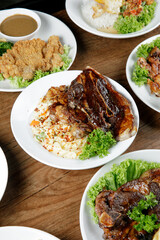 a plate of carbonara pasta with grill lamb shoulder