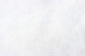 White snow close-up, texture and natural background with copy space