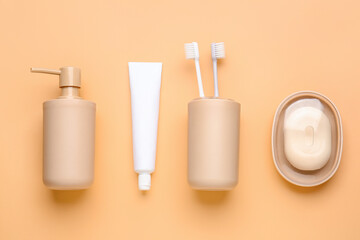 Set of bath accessories on color background