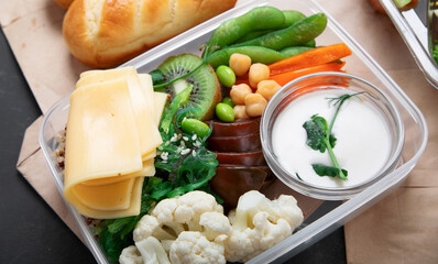 Takeaway lunch boxes with homemade nutrition food - meat, vegetables and fruits.