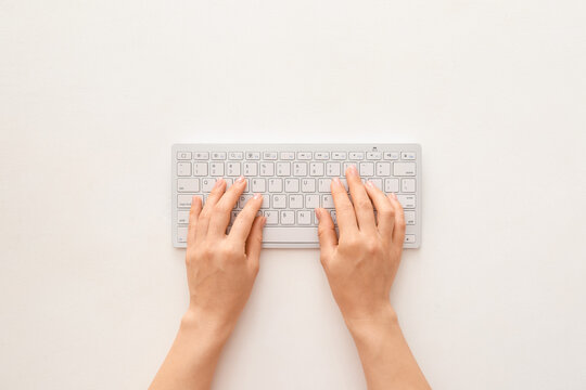 Female Hands With Computer Keyboard On White Background