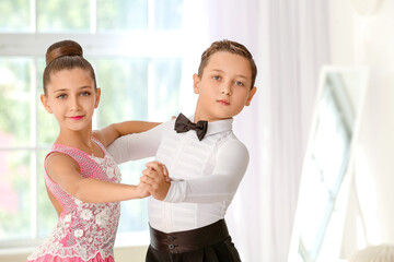 Cute little children dancing in studio