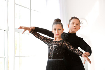 Cute little children dancing in studio