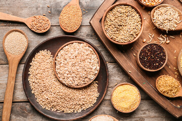 Assortment of cereals on wooden background