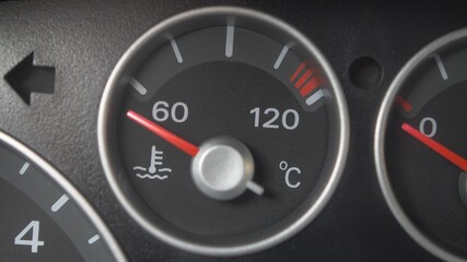 Oil Temperature Gauge and Indicator Lights of Starting and Stopping Car Close Up