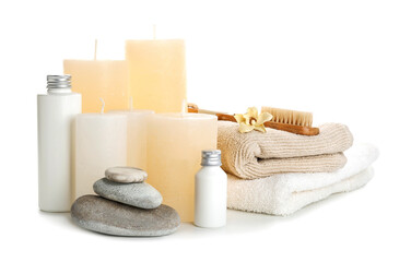 Spa composition with aroma candles on white background