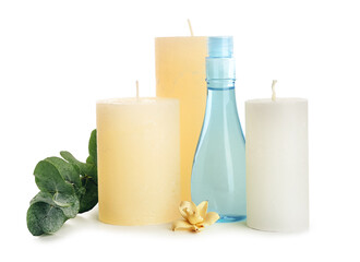 Aroma candles with cosmetics on white background