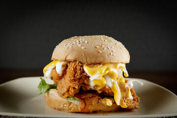 super delicious burger with melted cheese and french fries