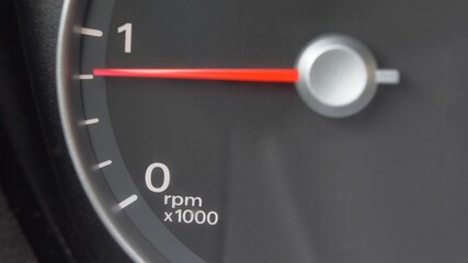 Naklejka premium Tachometer Gauge of Starting and Stopping Car Close Up