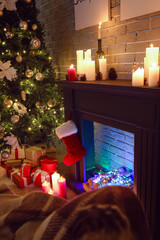Fireplace decorated for Christmas in interior of living room