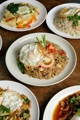 a plate of fried rice with fried egg