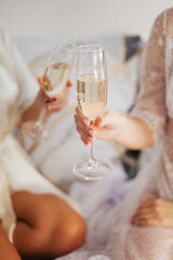 Champagne in a glass. Girls drink champagne. Festive mood.Bachelorette party.