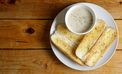 a set of garlic bread with mushroom soup