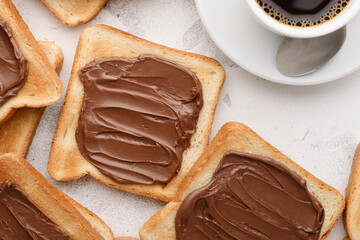 Bread toast with chocolate-nut paste spread and a cup of coffee: a nutritious snack