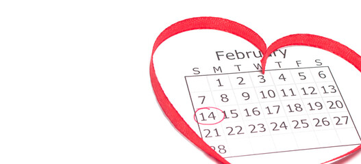 Calendar page with mark valentines day in red circle. February inside heart-shaped ribbon. Horizontal banner, copy space.
