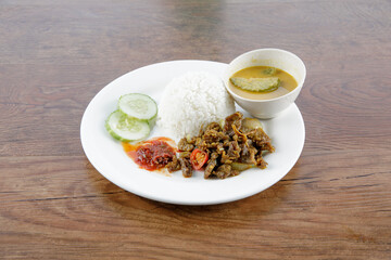 a plate of nasi berlauk