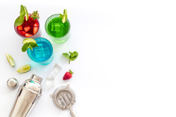 Mix of cocktails cold drink with ingredients and bar tools