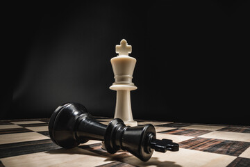 Obraz na płótnie Canvas Chess board with figures on dark background