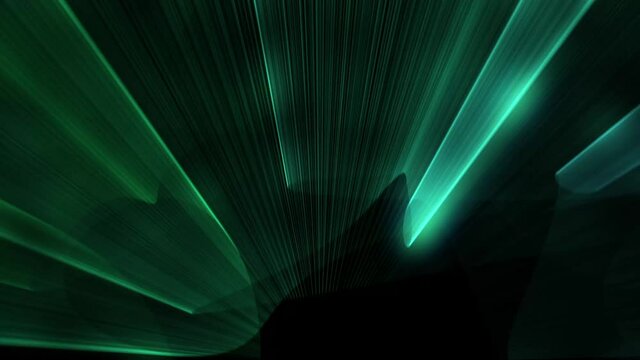 Green laser beams shoot upward and rotate against a black background.