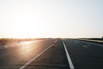 Fototapeta premium Empty highway with asphalt road and cloudy sky