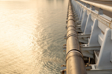 Pipe is installed along the bridge on the pipe support.