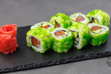 California sushi roll with green caviar close up