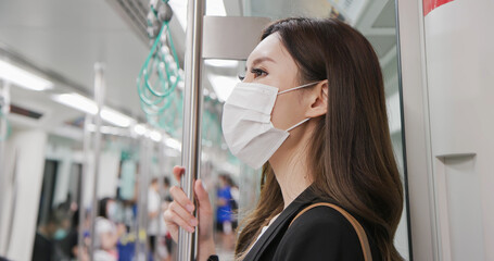 woman with mask in metro