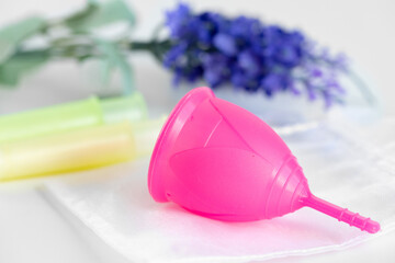 Menstrual cup and medical tampon close up