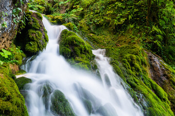 Beautiful scenic landscape of Isichenko waterfall in Kurdzhips Gorge in Caucasus mountains by Mezmai at summer, Russia
