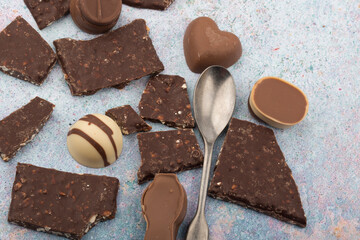 Broken chocolate chips pieces isolated on white background.