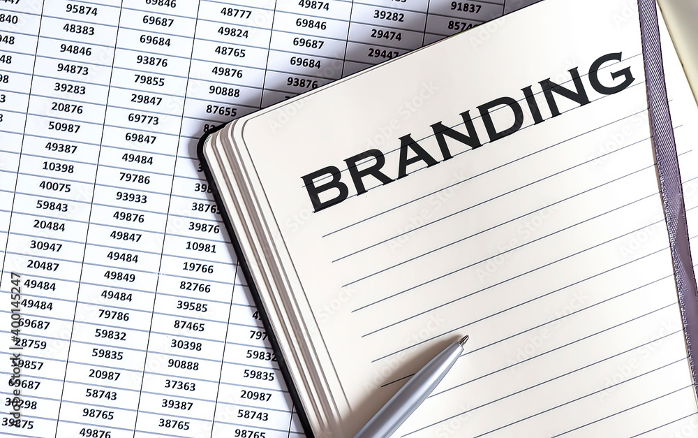 Poster business concept, on the table a notepad with the text of the branding