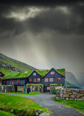 Typical nordic houses under ray lights from the clouds