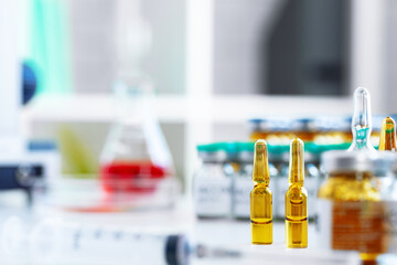 Glass bottle of medication for injections on table