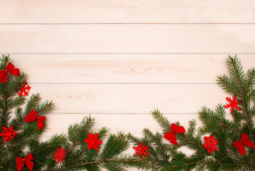 Fototapeta na wymiar Christmas tree on a wooden background top view. Festive background for the new year 2021. Elegant card decor for Christmas greetings.